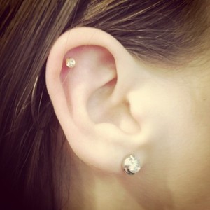 Lobe And Cartilage Piercing On Girl Right Ear