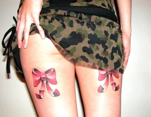 Pink And Black 3D Bow Tattoo On Back Thigh