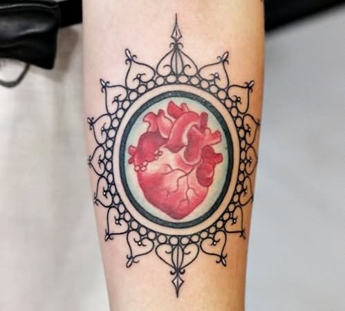 Red Real Heart In Frame Tattoo On Forearm