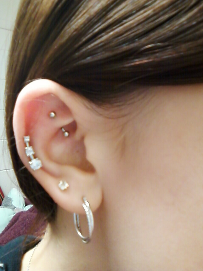 Right Ear Lobe and Rook Piercing With Silver Barbell