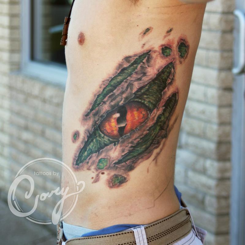 Ripped Skin Dinosaur Eye Tattoo On Man Side Rib