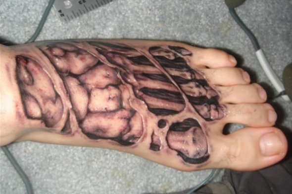Ripped Skin Foot Skeleton Tattoo On Foot