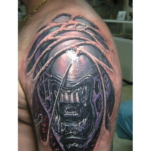 Ripped Skin Scary 3D Alien Face Tattoo On Man Shoulder