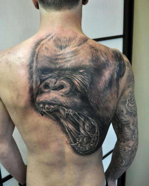 Roaring Gorilla Head Tattoo On Man Upper Back