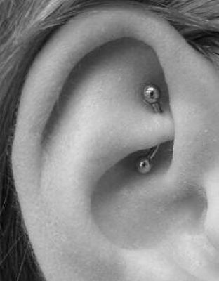 Rook Piercing On Right Ear With Curved Barbell