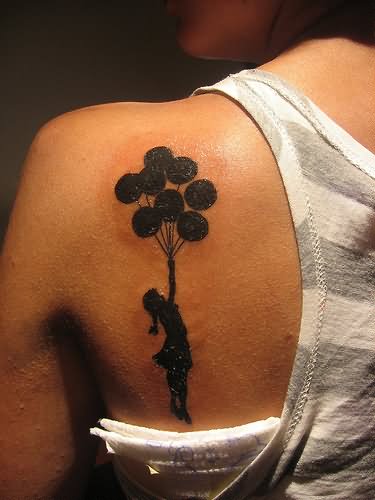 Silhouette Banksy Girl With Balloons Tattoo On Girl Left Back Shoulder