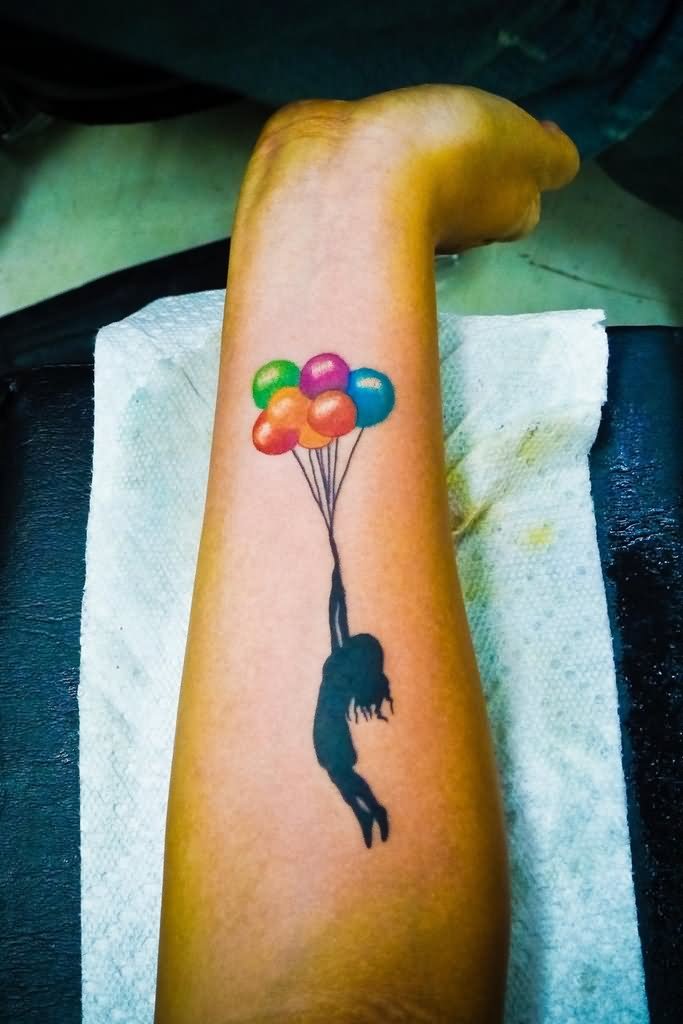 Silhouette Banksy Girl With Colorful Balloons Tattoo On Forearm
