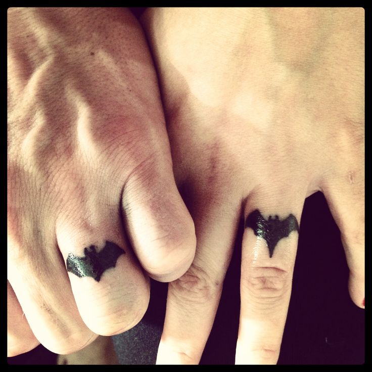Silhouette Batman Logo Ring Tattoo On Couple Finger