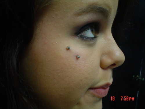 Silver Barbell Anti Eyebrow Piercing On Girl Right Side