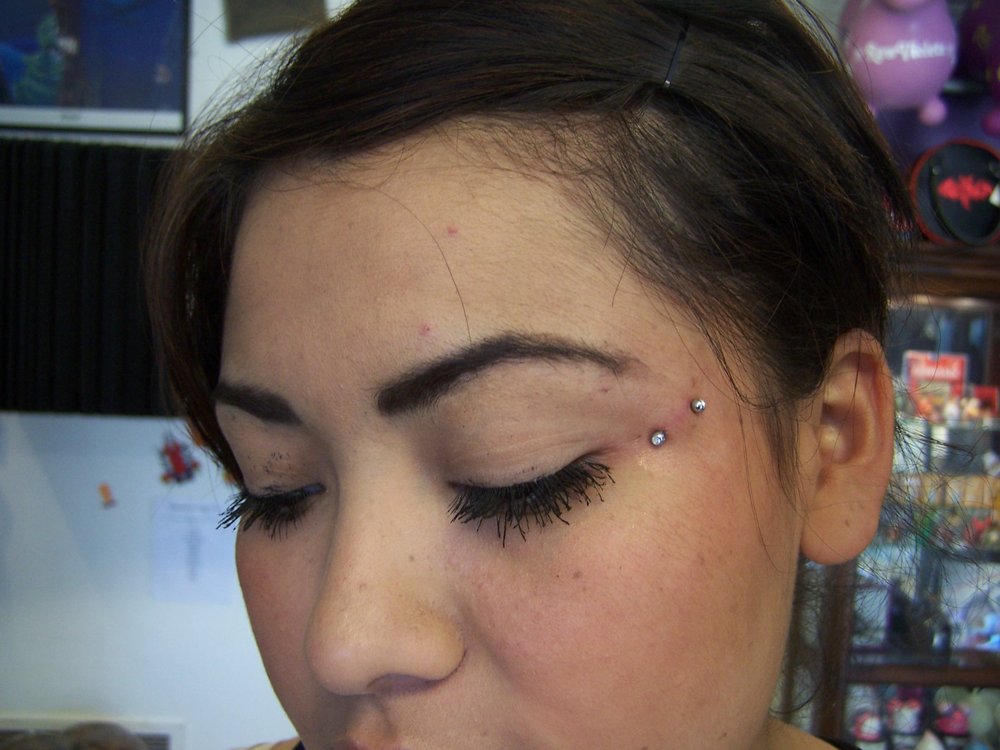 Silver Barbell Butterfly Kiss Piercing On Girl Face