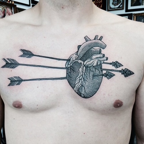 Three Arrow In Real Heart Tattoo On Man Chest