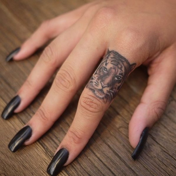 Tiger Face Ring Tattoo On Girl Finger