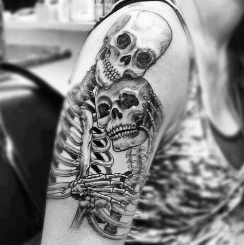 Two Human Skeleton Tattoo On Girl Shoulder
