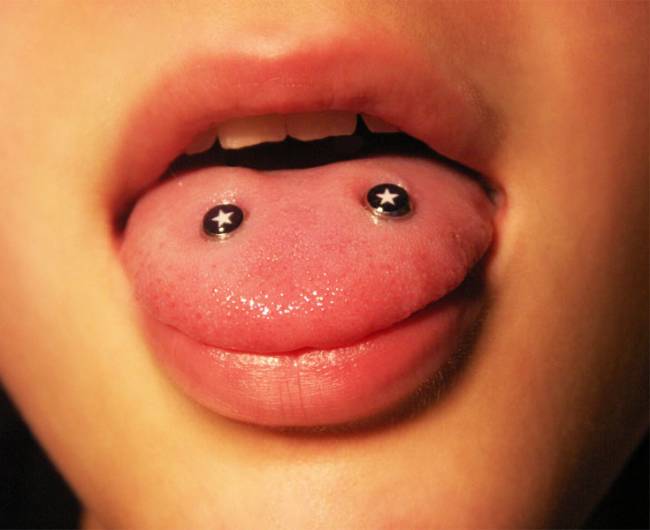 Venom Piercing On Tongue With Star Studs