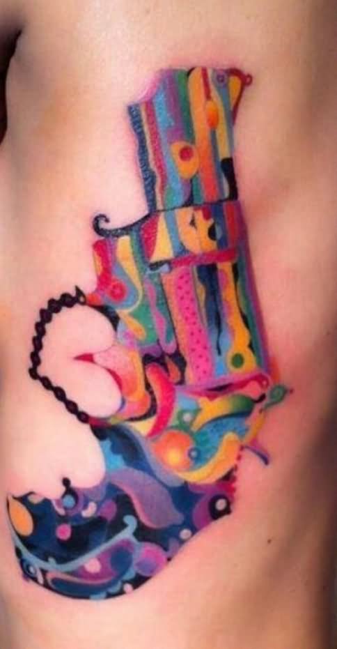 Watercolor Gun Tattoo On Side Rib