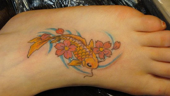 Yellow Fish With Flowers Tattoo On Foot By Miss Jenn