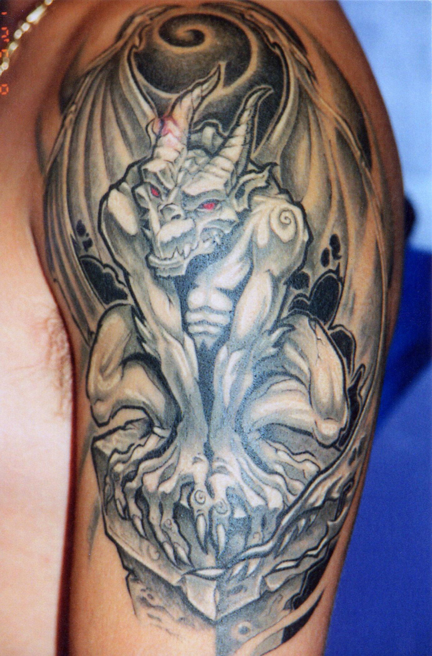 Amazing Black And Grey Gargoyle Tattoo On Man Left Shoulder