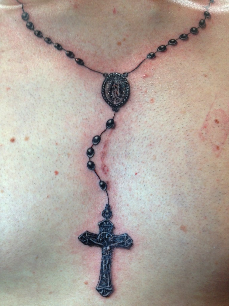 Awesome Black Rosary Tattoo On Man Chest