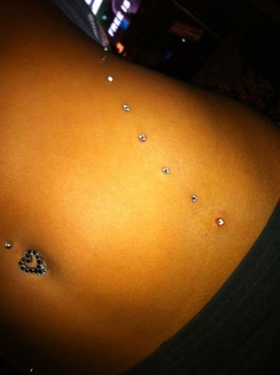 Beautiful Navel And Web Piercing Picture