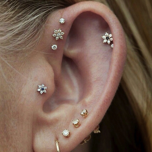Beautiful Triple Lobe And Anti Helix Piercing With Flower Stud