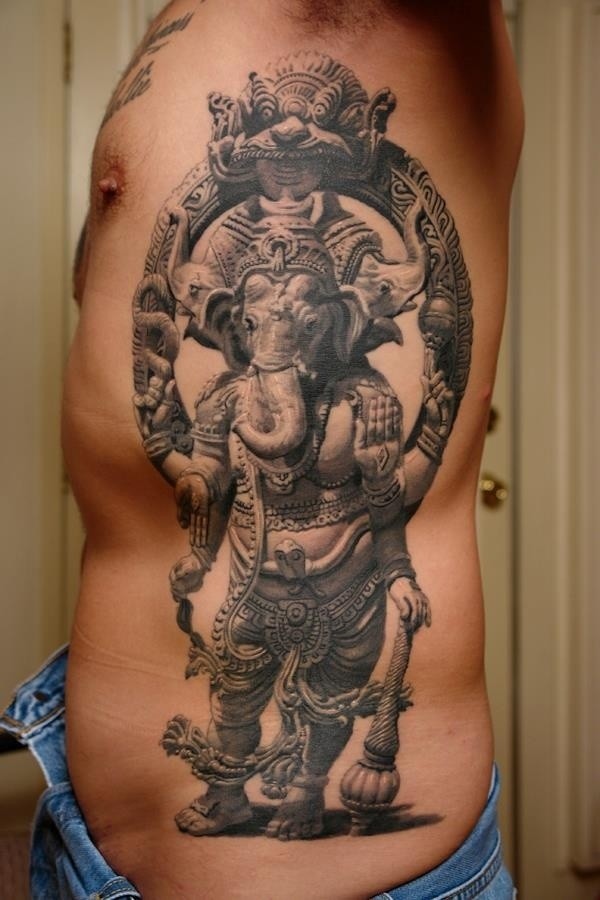 Black And Grey 3D Lord Ganesha Hinduism Tattoo On Man Side Rib