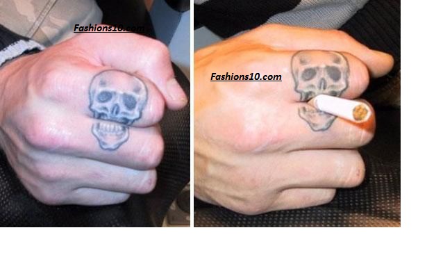Black And Grey Funny Skull Tattoo On Finger