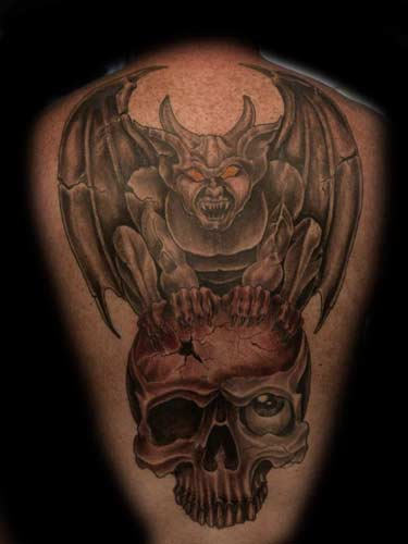 Black And Grey Gargoyle On Skull Tattoo Design