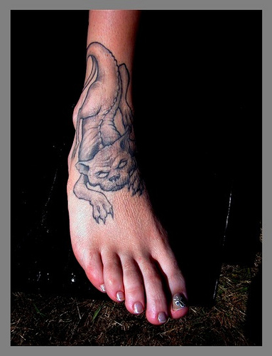 Black And Grey Gargoyle Tattoo On Foot