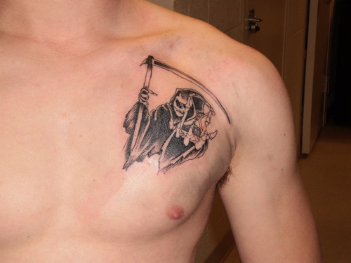 Black And Grey Grim Reaper Tattoo On Man Left Front Shoulder