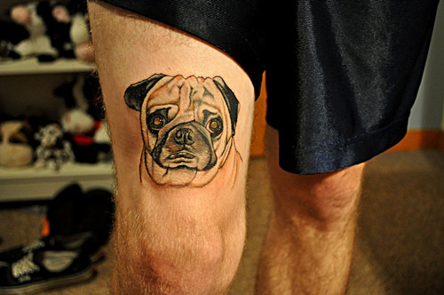 Black And Grey Pug Face Tattoo On Man Right Thigh