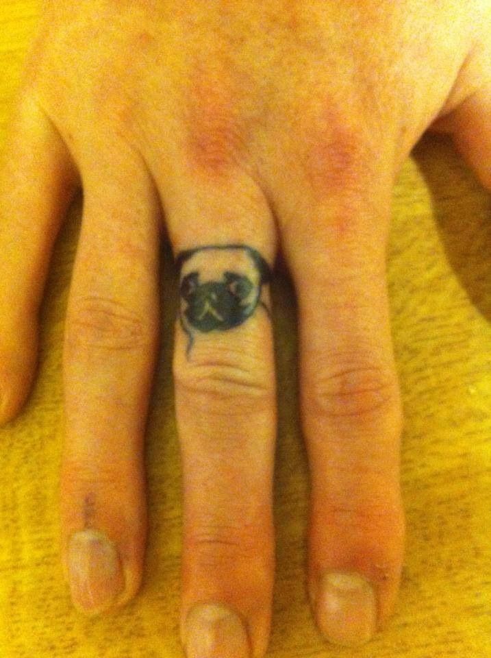Black Pug Dog Face Tattoo On Finger