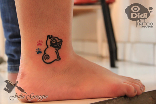 Black Pug With Colorful Two Paw Print Tattoo On Ankle