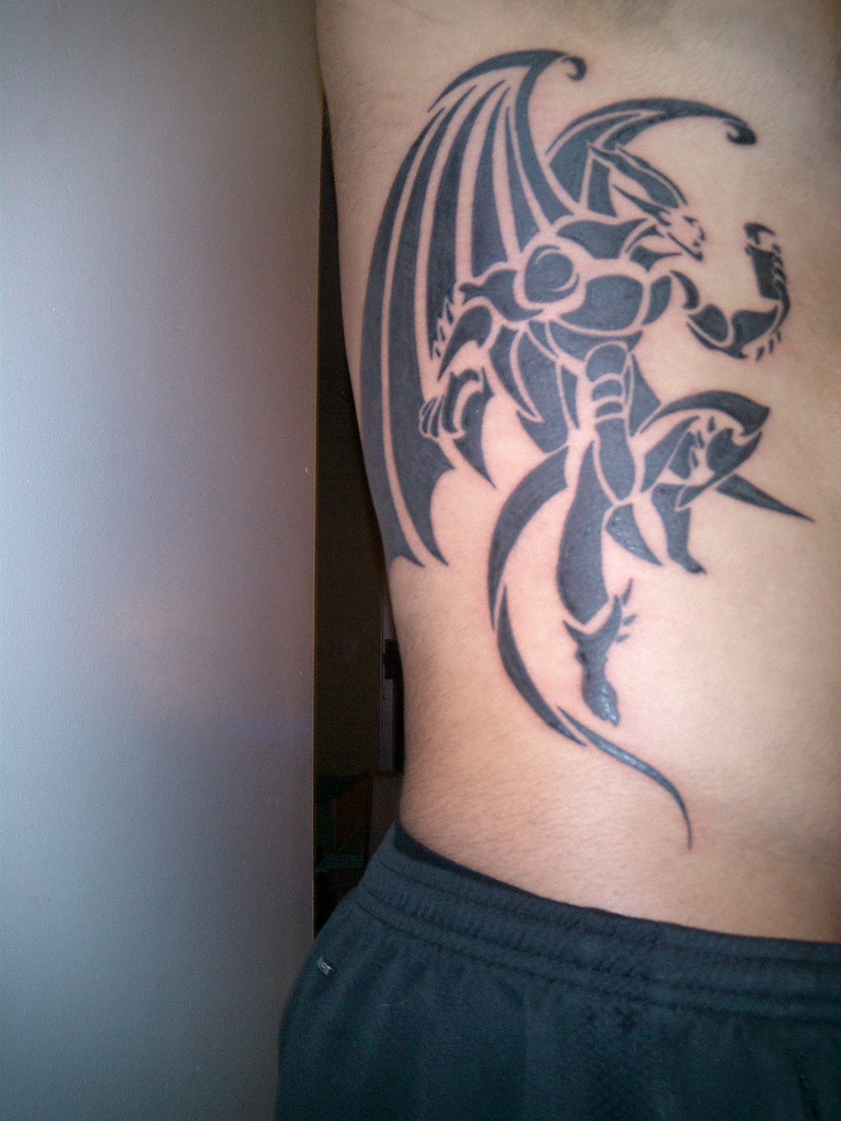 Black Tribal Gargoyle Tattoo On Side Rib