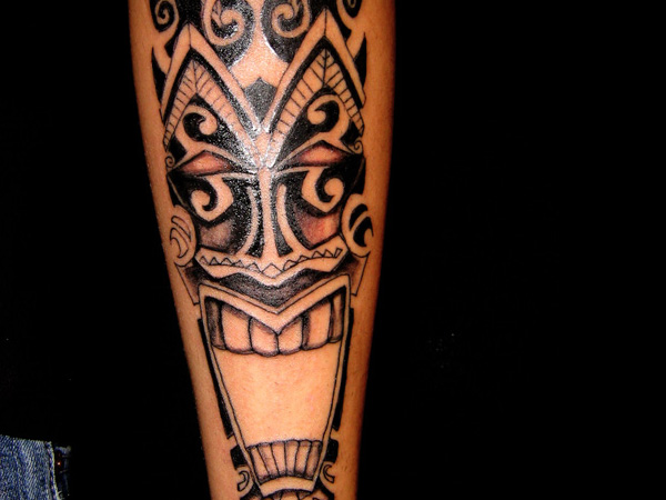 Black Tribal Tiki Tattoo Design For Forearm