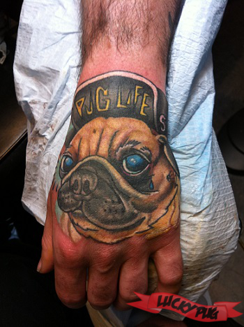 Colorful 3D Pug Face Tattoo On Left Hand