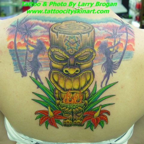 Colorful 3D Wooden Tiki Tattoo On Girl Upper Back By Larry Borgan