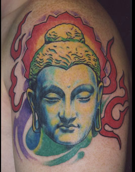 Colorful Buddhist Face Tattoo On Shoulder