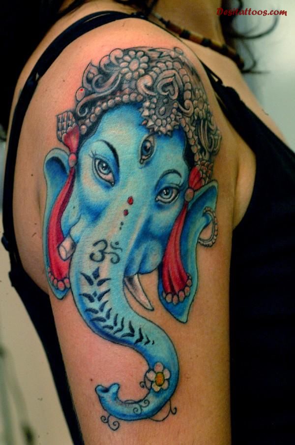 Colorful Lord Ganesha Hinduism Head Tattoo On Girl Right Shoulder