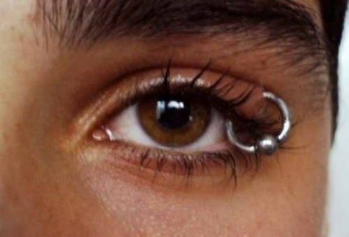 Eye Piercing With Silver Bead Ring