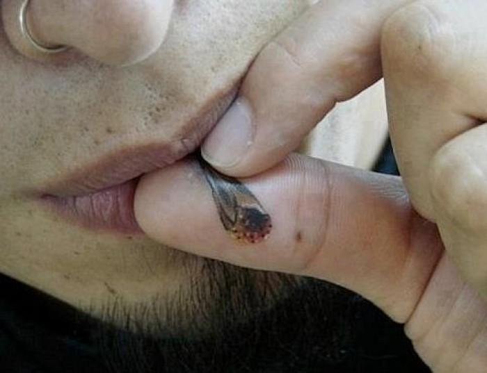 Funny Cigarette Tattoo On Man Hand Thumb