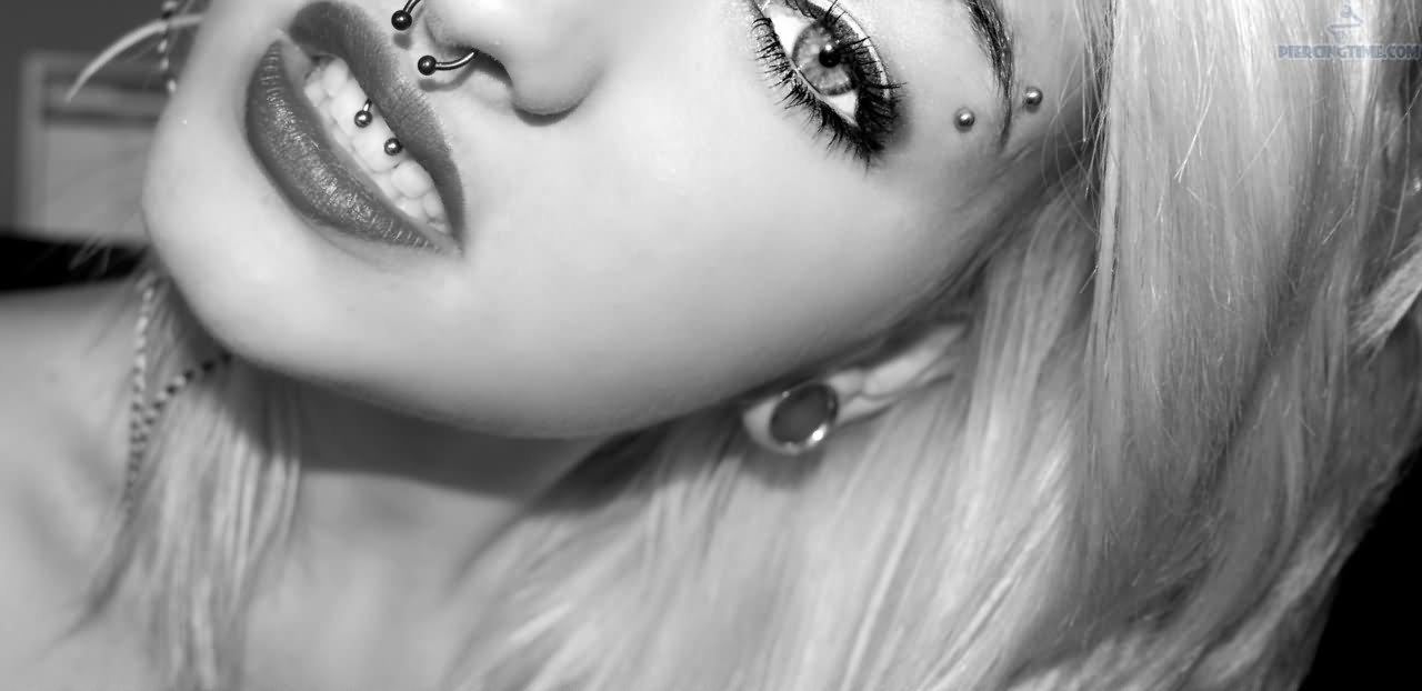 Girl With Septum And Smiley Piercing