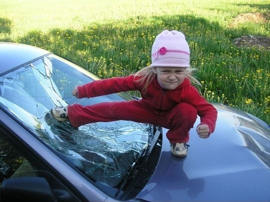 Little Girl Funny Kick On The Car's Mirror