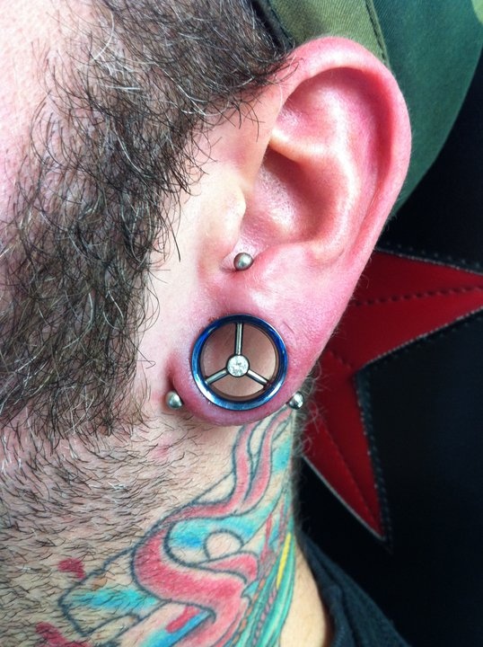 Man With Awesome Transverse Lobe Piercing For Men