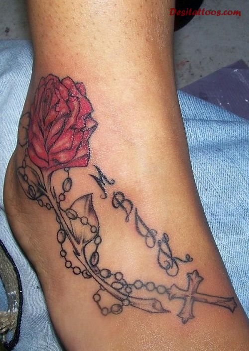Red Rose With Rosary Cross Tattoo On Foot