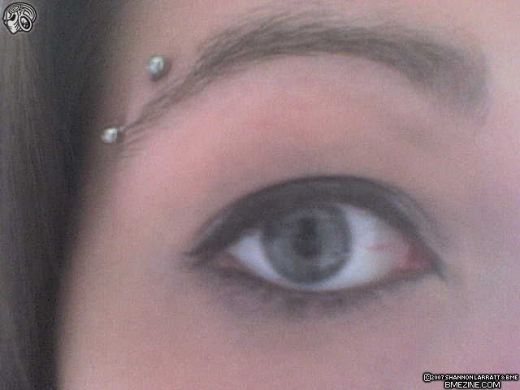 Right Eyebrow Piercing With Silver Barbell