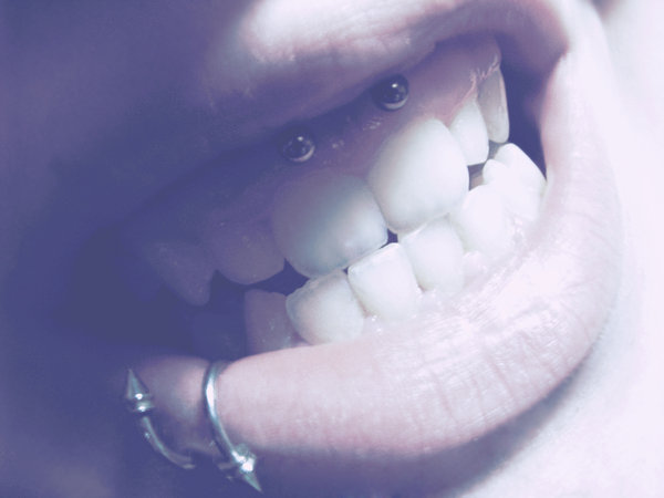 Spiral Lower Lip and Smiley Piercing Image