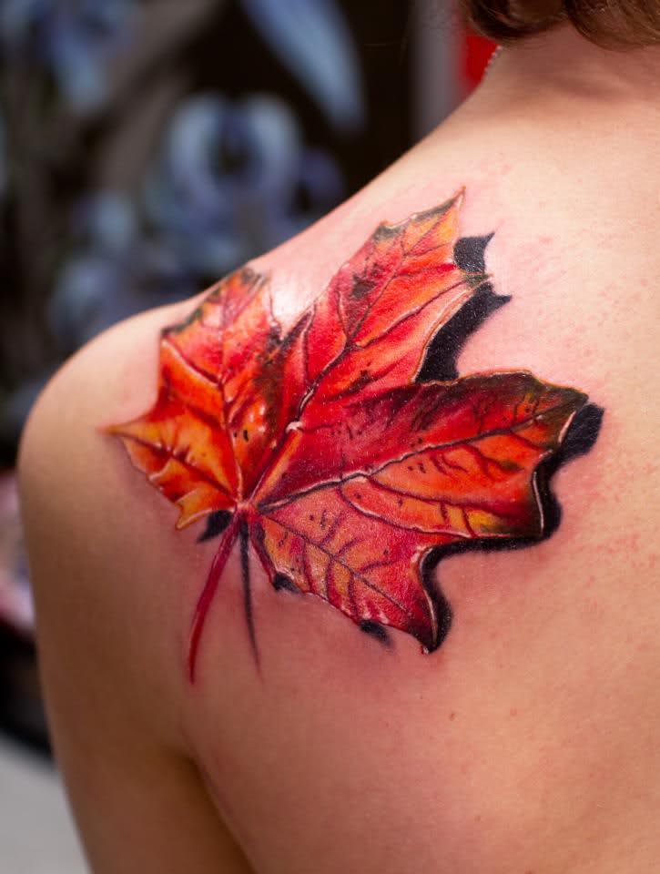 Amazing 3D Maple Leaf Tattoo On Left Back Shoulder