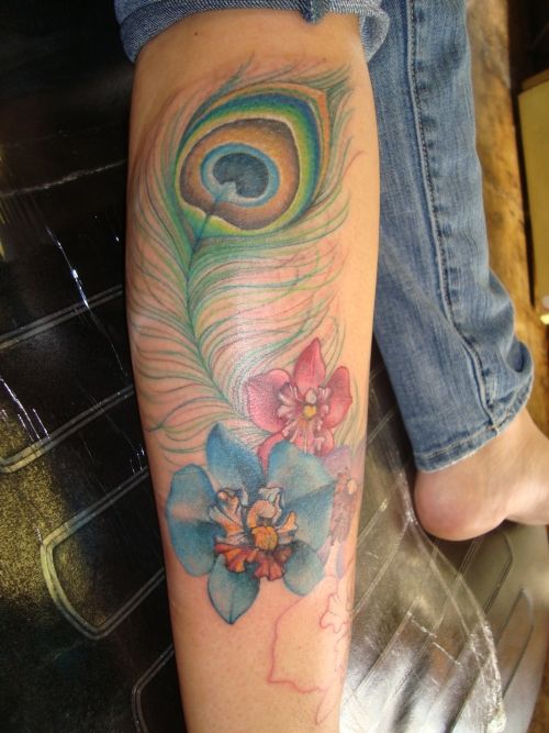 Awesome Peacock Feather With Flowers Tattoo On Leg