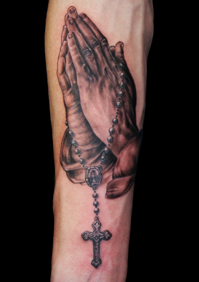 Black And Grey 3D Rosary Cross In Praying Hands Tattoo On Forearm