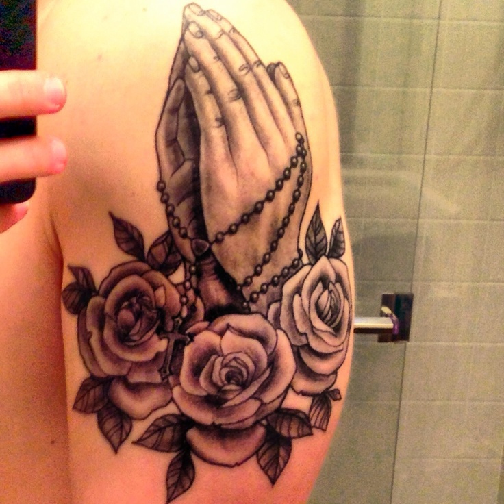 Black And Grey 3D Rosary Cross In Praying Hands With Roses Tattoo On Shoulder